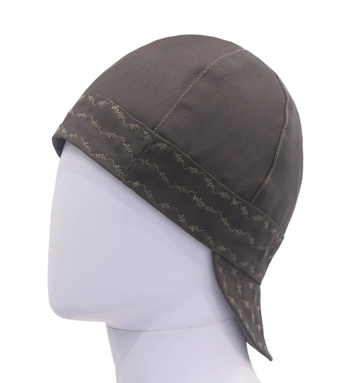 Side view of Workhorse Flame Resistant Welding Cap 10 Oz Cotton Duck Exterior With Water Repellent Oil Resistant Finish Two Sided Six Panel Welder Hat With Plaid Inner Lining ATPV 14 Arc Shield Size Seven And Three Eighths Green on mannequin head.
