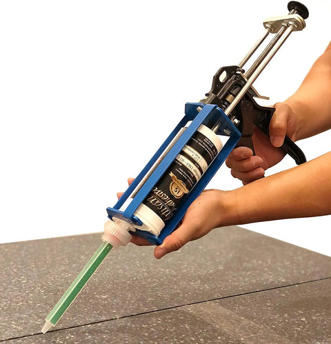 Hands using Heavy Duty All Metal Adhesive Dispenser Gun For 250mL Cartridges, 2 Part Epoxy, 10:1 Mix Ratio, 25:1 Mechanical Advantage