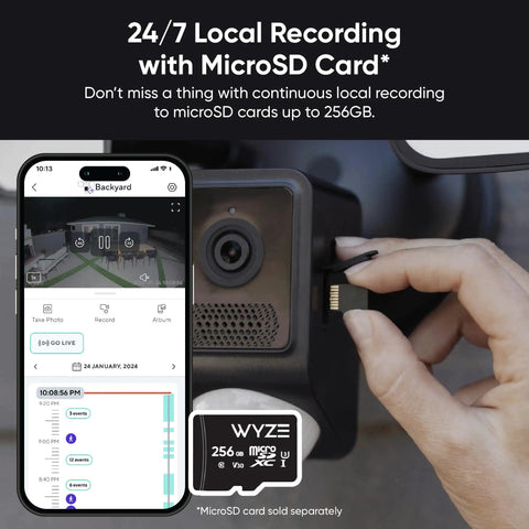Hand inserting microSD card into Outdoor Floodlight Security Camera 2K HD With Color Night Vision, 2800-Lumen LEDs, 160-Degree Wide View