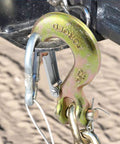5/16 Chain Hook With Safety Latch Heavy Duty Clevis Slip Hook Grade 70 Forged Steel 14,000 Lbs Capacity Ideal For Towing, Rigging, And Industrial Construction Projects attached to a chain