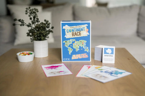 Continent Race Geography Board Game For Kid Friendly Families And Friends Learn Flags And Countries From Around The World With Fun Brain Boosts Game Night Ready For Classrooms And Home box on table.
