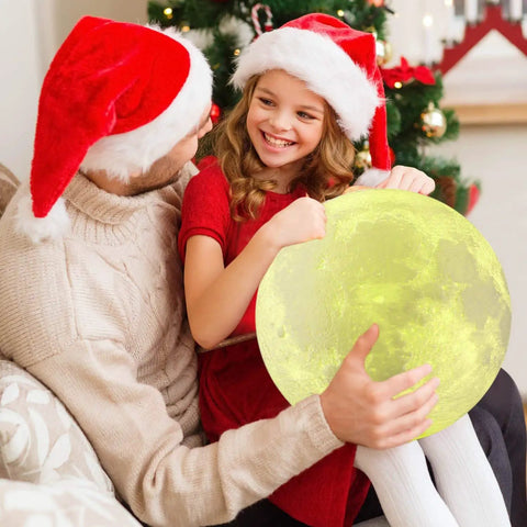 Father and daughter holding Dope Moon Lamp Night Light With Time Settings And Stand 3D Printed LED Moon With 16 Color Modes.
