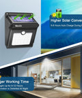 Solar Outdoor Security Lights Wireless Motion Sensor Waterproof LED Path Lighting for Front Door Backyard Steps Garage Garden with 400LM Output 4 Pack Durable Weatherproof Design illustrating solar charging and night use by entryway.