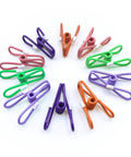 Slick 10 Pack Colorful Metal Chip Bag Clips With Rubber Finger Guards And Heavy Spring Steel Design in assorted colors arranged on white background.