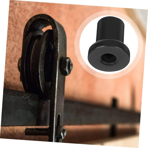 Close-up of a 4 Pack Carbon Steel Sliding Barn Door Track Spacers And Connectors For Wall And Rail Track Spacer Assemblies installed on a door