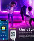 Children dancing in room lit by 150ft Multi Color RGB LED Strip Lights With Bluetooth App Control and 44 Key Remote, music sync feature displayed.