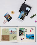 Selphy CP1500 Photo Printer Bundle Wireless Dye Sub Kit printing photos on scrapbook with dried flowers and memories