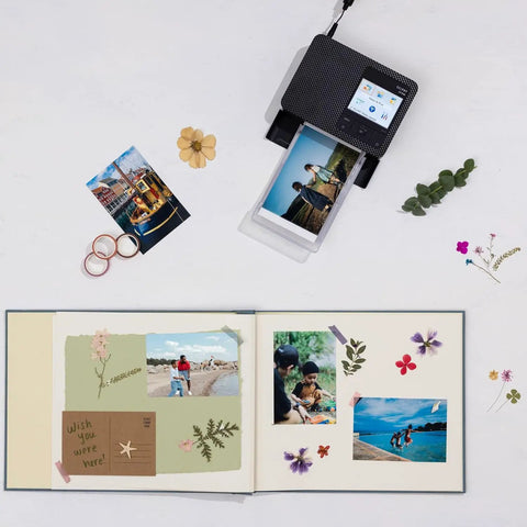 Selphy CP1500 Photo Printer Bundle Wireless Dye Sub Kit printing photos on scrapbook with dried flowers and memories
