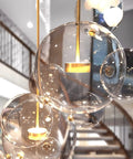 Modern LED Globe Pendant Light With Four Bubble Glass Orbs, Dimmable 3000K-6000K, close-up of orbs with gold fixtures, 21.65 inch