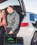 Couple by EV in trunk holding portable charger, showcasing Level Two EV Charger With 240V NEMA 14 To 50 Plug And 25 Foot Cable UL Certified.