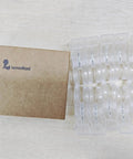 Go-To 10 Pack Large Balloon Arch Clips 3.5 Inch Transparent Spring Clamps beside packaging box on wooden surface