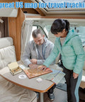 USA Travel Cork Map Set With 100 Push Pins And Wooden Storage Box 12x8 Inches in use inside an RV by two people planning a trip.