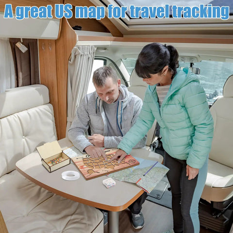 USA Travel Cork Map Set With 100 Push Pins And Wooden Storage Box 12x8 Inches in use inside an RV by two people planning a trip.
