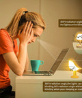 Woman working at desk with Cordless Bird Night Light With Touch Dimmer, Rechargeable Hummingbird Bedside Lamp For Bedroom Or Desk