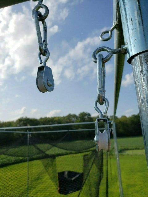 7/8 Inch Nylon Swivel Pulleys For Batting Cage Cable System in outdoor setup, showing smooth rolling rigging pulleys for wire.