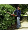 Person using Powerful 20V Max Cordless Hedge Trimmer No-Fuss 22 Inch Dual Action Steel Blade Tool Only Lightweight Soft Grip