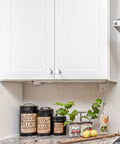 White kitchen cabinets with 30 Pack 1-1/4 Inch Polished Chrome Cabinet Knobs Rugged Zinc Hardware for a sleek, modern look.