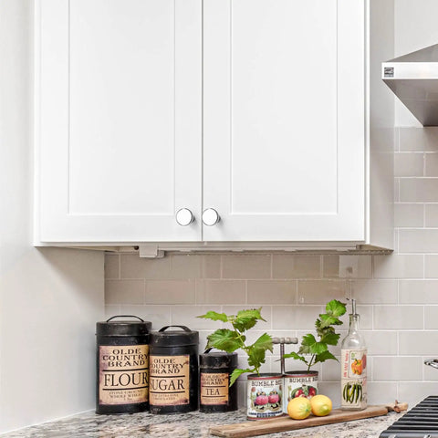 White kitchen cabinets with 30 Pack 1-1/4 Inch Polished Chrome Cabinet Knobs Rugged Zinc Hardware for a sleek, modern look.