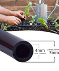 Close-up of 100 Ft One Quarter Inch Blank Distribution Tubing for Drip Irrigation in garden use, showing size details.