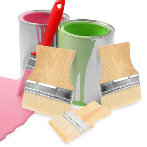 Three-piece flat tip paint brush set with wood handles near two paint cans, designed for furniture, deck, and wall projects.