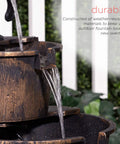 Close-up of Rustic Two Tier Barrel Outdoor Water Fountain With Chill Cascading Flow For Patio Yard Porch Or Landscape Bronze Finish