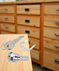 Universal Stainless Toolbox Lock With 180 Degree Rotation For Cabinets And Drawers Built Tough Cylinder Lock Includes 2 Keys And 1 Fastening Tab Fits Most Toolboxes And Cabinets. stainless lock with keys and fastening tab on wooden desk