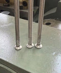 Automatic Steel Wire Nail Making Machine Pro Grade High Efficiency Nail Forming Equipment For Industrial Production And Construction Projects Durable Heavy Duty Metal Nail Maker, close-up of steel nails