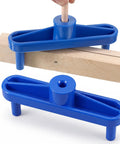 Rock Solid Magnetic Center Finder Tool For Woodworkers Needing Dead On Drill Layouts With Durable ABS Construction And Killer Precision Throughout Every Project, two blue magnetic rulers positioned on wood.