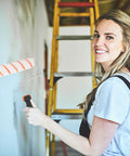 Knock Your Next Reno Out Of The Park With This Smooth Ride Roller And Brush Set Having A Solid Tray Ideal For Walls Ceilings And Doors Making Paint Work Feel Like A Breeze, woman painting wall with roller.