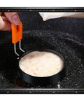 Set Of 6 Round Egg Rings And Pancake Molds With Silicone Handles, 3.5 Inch And 6 Inch Sizes, batter in round ring on stove