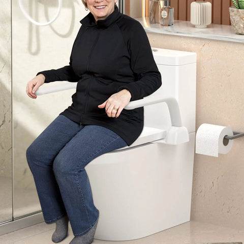 A senior woman using Heavy Duty Aluminum Toilet Safety Rails for support while sitting on a toilet, showcasing its functionality.