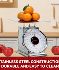 44 Lbs Stainless Steel Mechanical Kitchen Scale Built Like A Tank For Precise Portion Control Heavy Duty Produce Scale With Durable Stainless Platform Rust Resistant Body And Clear Dial displaying oranges