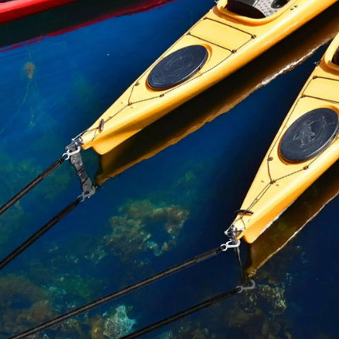 Elastic Dock Line With Metal Hook And Loop Ends 48 Inches mooring yellow kayaks on clear water, close-up view.