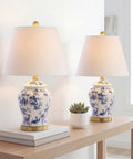 Blue and white ceramic ginger jar table lamp with white linen shade, 22 inch tall, on a wooden table, French country style