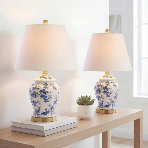 Blue and white ceramic ginger jar table lamp with white linen shade, 22 inch tall, on a wooden table, French country style