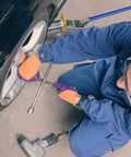 Mechanic using Beefy 2 Ton Horizontal Hydraulic Floor Jack With Rugged Carbon Steel Lever Handle for car lift in garage