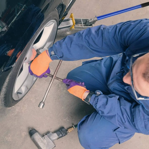Mechanic using Beefy 2 Ton Horizontal Hydraulic Floor Jack With Rugged Carbon Steel Lever Handle for car lift in garage
