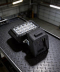 Cordless Work Light for 18V for battery High Brightness LED Floodlight on black textured surface, showcasing durable design.