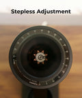 Solid Single Dose Coffee Grinder Featuring 63Mm Red Titanium Conical Burrs And Plasma Ionizer, displaying stepless adjustment dial.