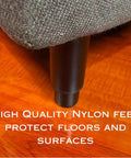 Close-up of furniture leg, satin black finish, on wooden surface from Beefy Heavy Duty 6 To 10 Inch Adjustable Metal Furniture Legs