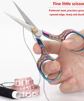 Two-piece rainbow embroidery scissors with ornate multicolor handles; front view for sewing and crafts.