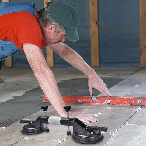 Man using 2 Pack Seamless Seam Setter With Vacuum Suction Cups for Granite Marble Slab Countertops, adjusting stone tiles on floor
