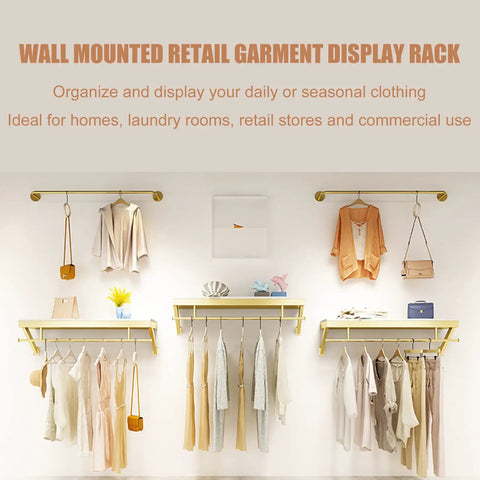 Top Shelf Wall Mounted Clothing Rack System Kit Crafted from Rock Solid Wrought Iron Pipes and Rugged Pine Boards for Boutique or Main Street Closets That Can Take Some Serious Wear and Tear, organized display of clothing.