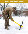 Person using 36 Inch Pick Mattock With Heavy Duty Rail Steel Head And Fiberglass Handle, 2 In 1 Adze Hoe And Pick Axe in snow.