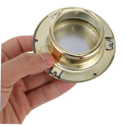 Four Pack Heavy Duty Metal Fire Sprinkler Nozzle Cover Plates showing a gold metal plate held by a hand for easy installation on concealed systems.