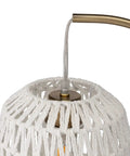 Close-up of white woven rattan shade and gold hardware on Tall Industrial Gold Rattan Bedside Table Lamp With USB Charge Port.