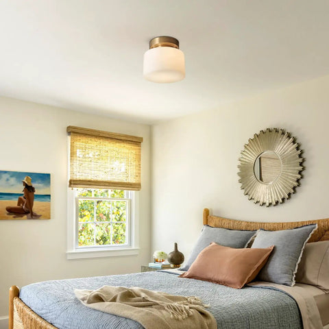 Modern Brushed Gold Semi Flush Drum Ceiling Light Fixture With Milk Glass Shade in a cozy bedroom setting