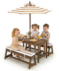 Children using Kid Approved Outdoor Picnic Table Set With Cushioned Benches, Adjustable Height Table, Built In Umbrella, Coffee Finish.