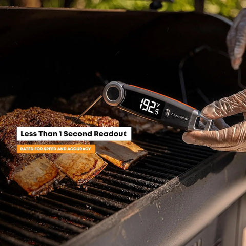 Hand holding X10 Instant Read Digital Meat Thermometer With Rotating Probe Backlit Display And Waterproof Pro Kitchen Tool on grill