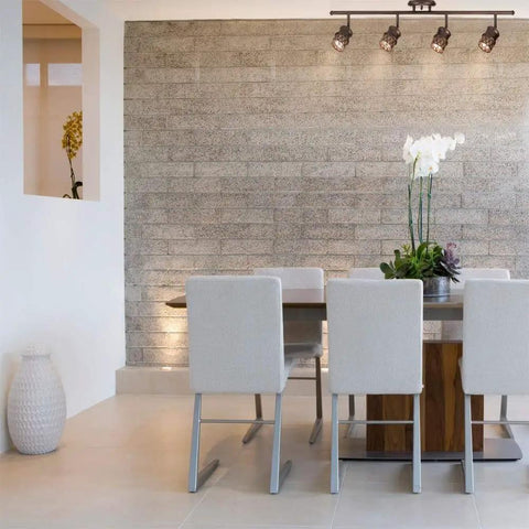 Dining room with Norris 4-Light Track Lighting in Oil Rubbed Bronze With Champagne Glass Heads over modern table.